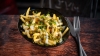 Aioli and gherkins loaded fries